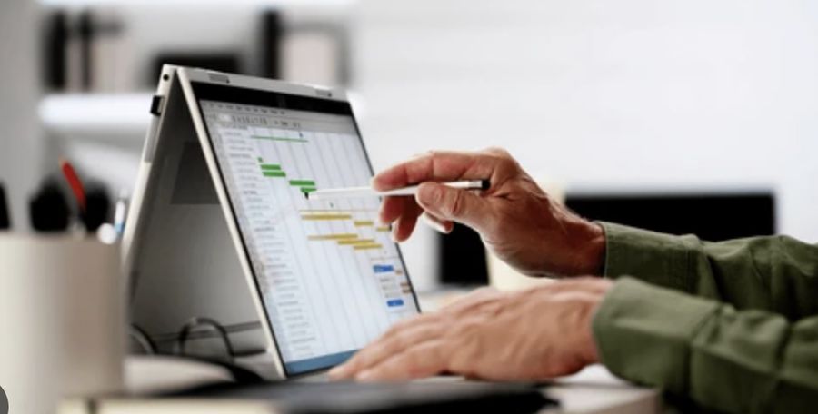 Scheduling an electrical project on a laptop with Gantt timeline